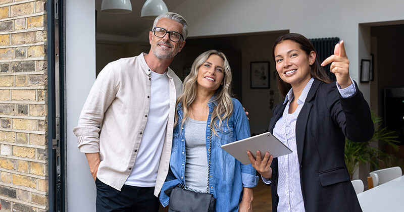 Couple viewing rental property with real estate agent